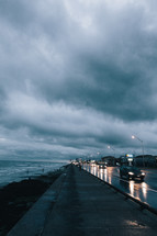 rain clouds and wet roads on a coastal highway
