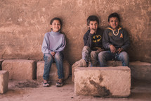 children sitting in an old historic building 