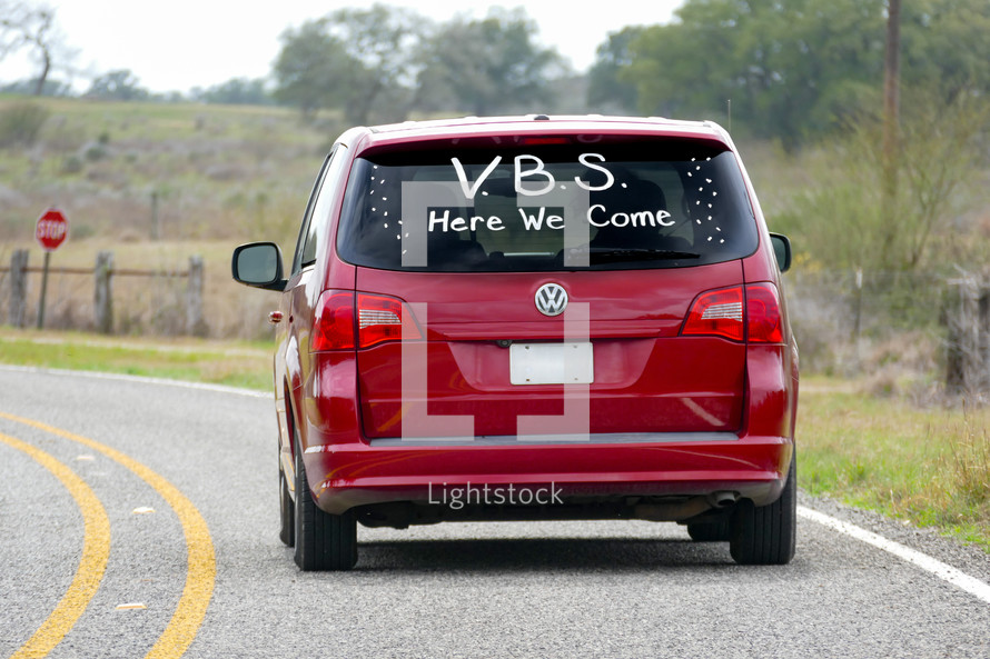 minivan with VBS Here we come on the back window 