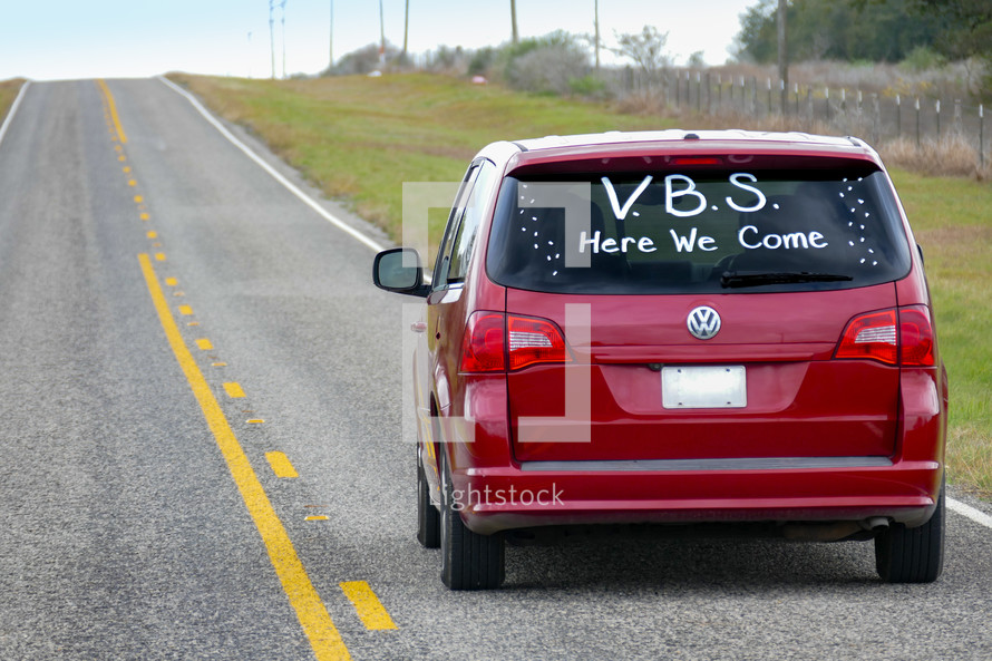 minivan with VBS Here we come on the back window 