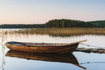 Wooden boat on still lake