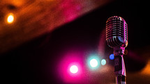microphone and glowing stage lights 