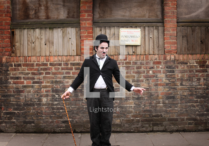 man in a suit and cane 
