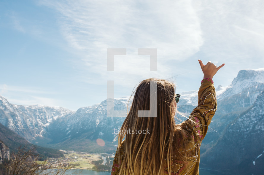a woman standing on a mountaintop in Austria 