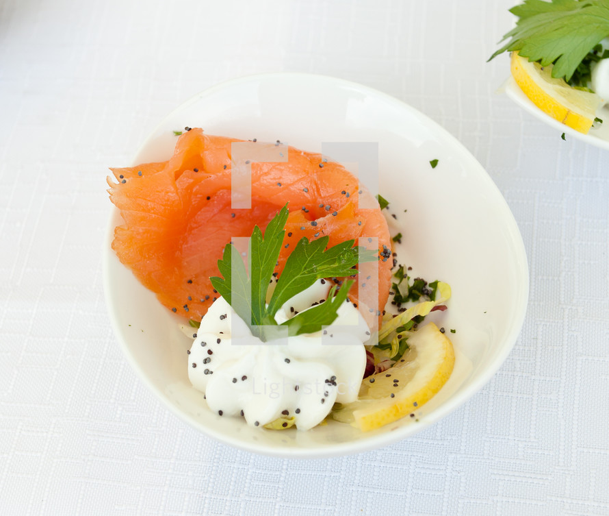 Finger food with smoked salmon in the bowl