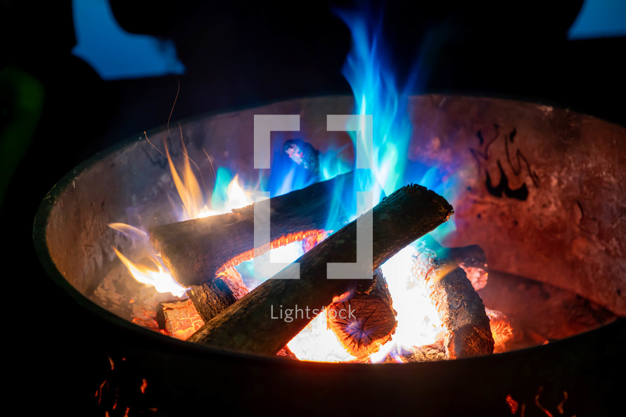 blue flames in a fire pit 