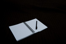 blank pages of an opened notebook 