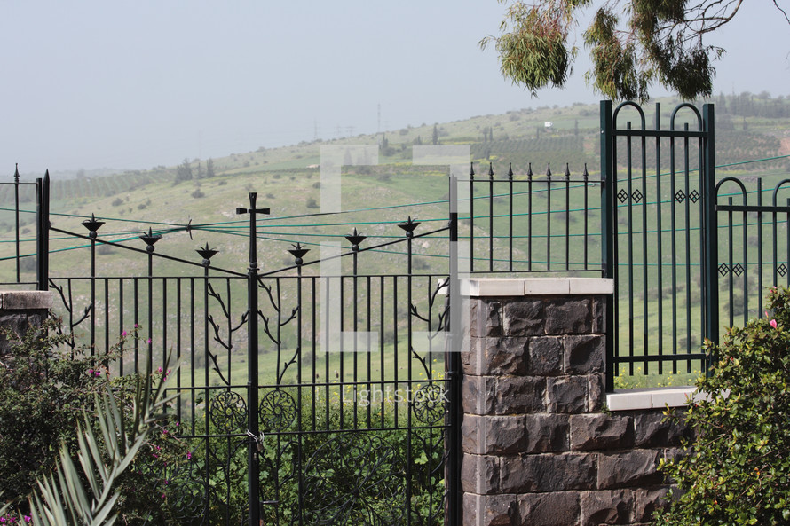 wrought iron fence in churchyard on the hills above the Sea of Galilee