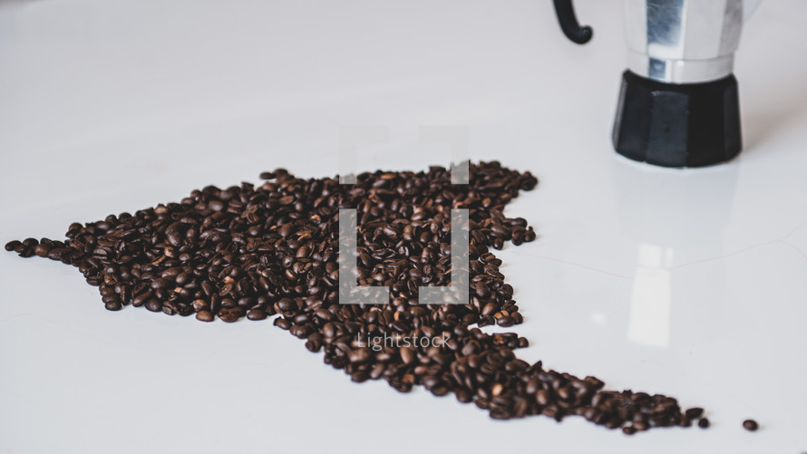 coffee beans in the form of the mainland of South America on a white background