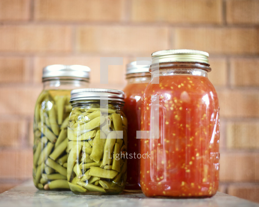 Green beans and salsa in jars.
