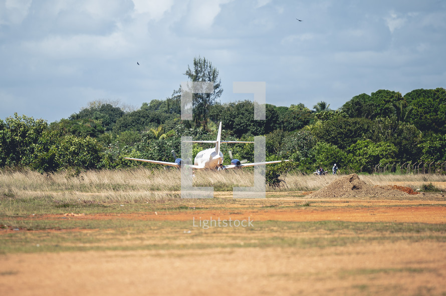 plane on a dirt runway in Honduras 