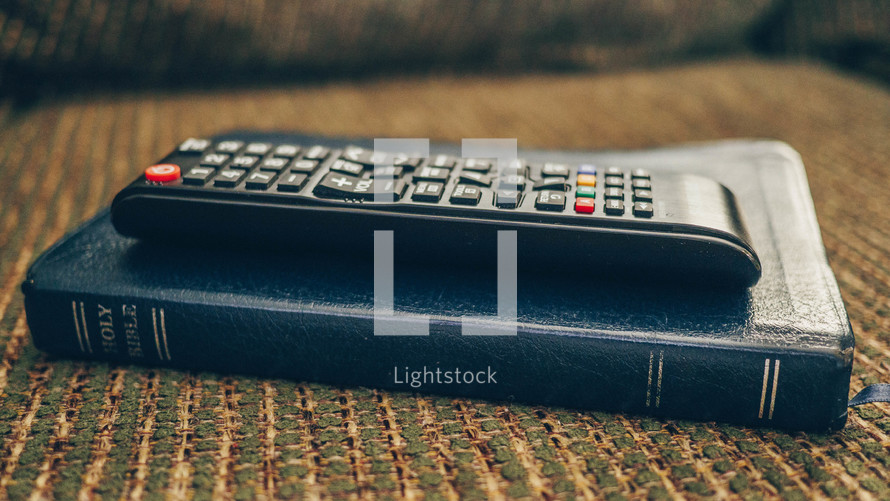 remote control on a Bible 