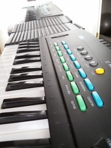 An Electronic Keyboard used in live band worship, praise concerts and recording of electronic church and Christian music with different synthesizer programmable keyboard elements such as guitar,  brass horns and other emulated sounds for playing before live audiences or mixing recorded music in the studio. 