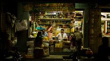 vendors at a street market at night 