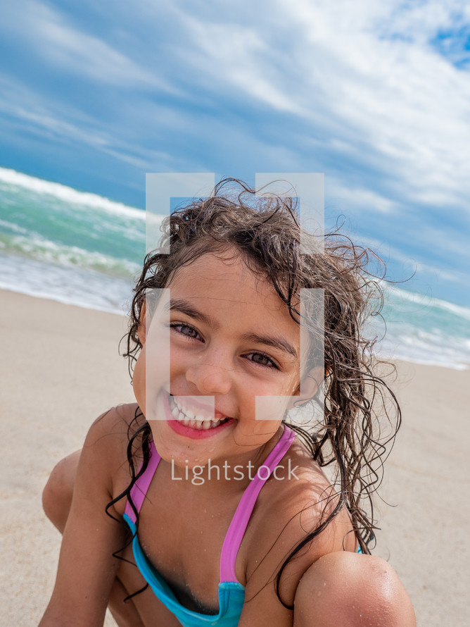 smiling kid on a beach 