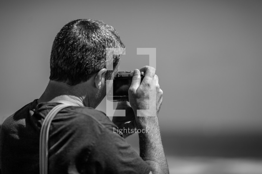 a man with a camera taking a picture 