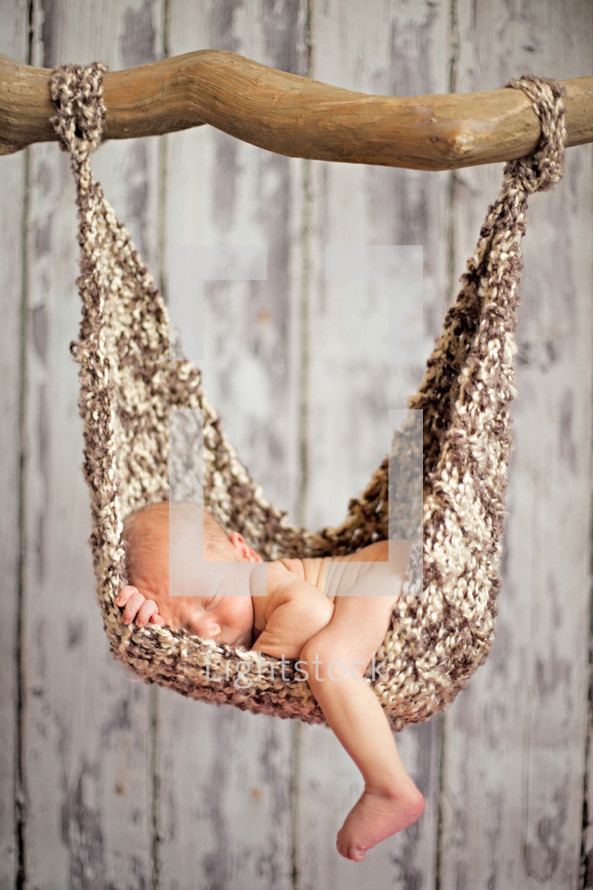 Infant lying in hammock