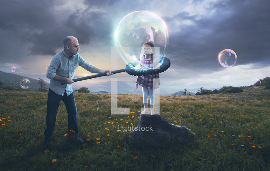 A father puts his reluctant child inside a bubble