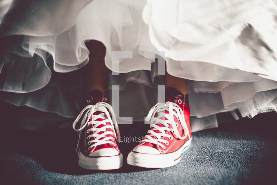 sneakers under a wedding gown 