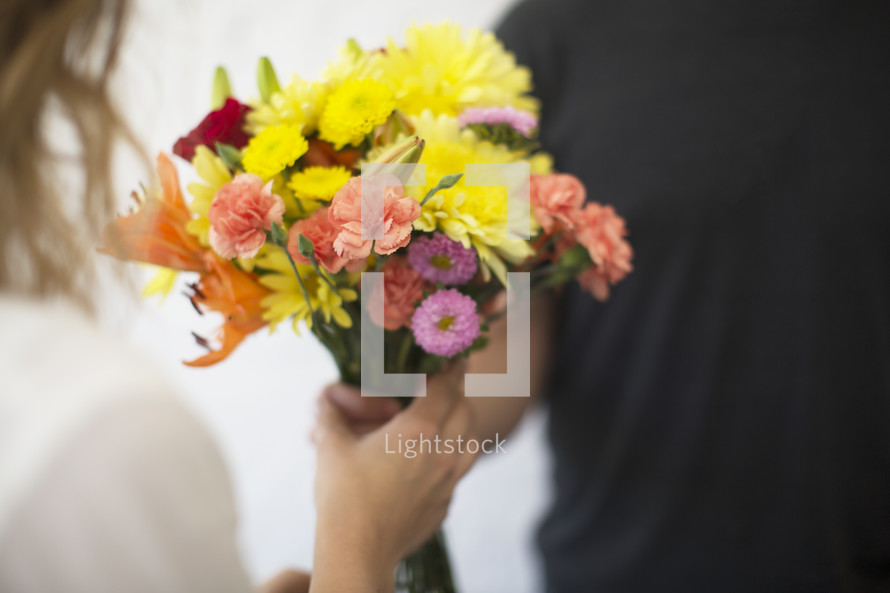a man giving flowers to a woman, bridesmaid, gift, spring, summer, love, anniversary, bundle, woman, receiving, flower, flowers, colorful, giving