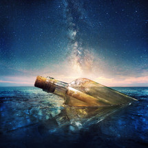 stars in the sky and a message in a bottle lost at sea 