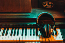 headphones on a piano 