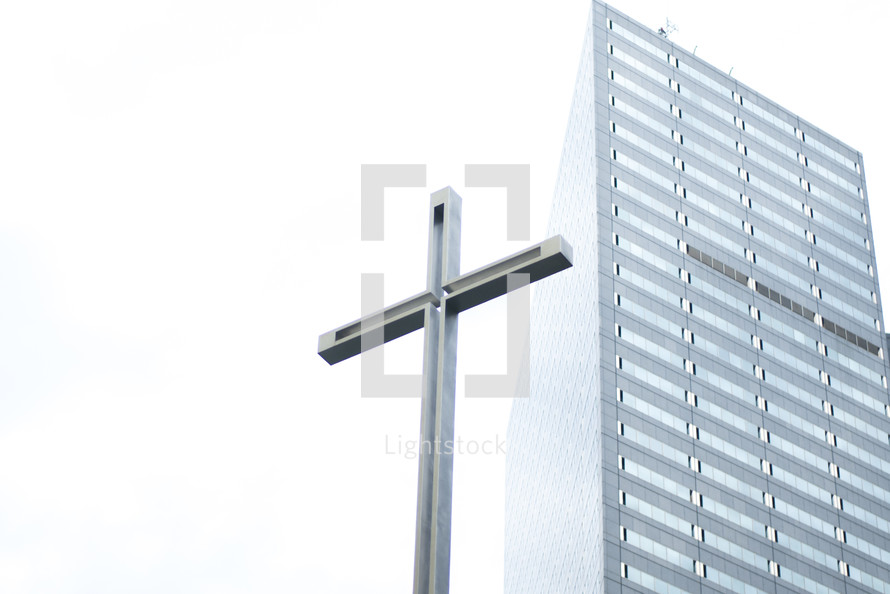 cross and tall building 