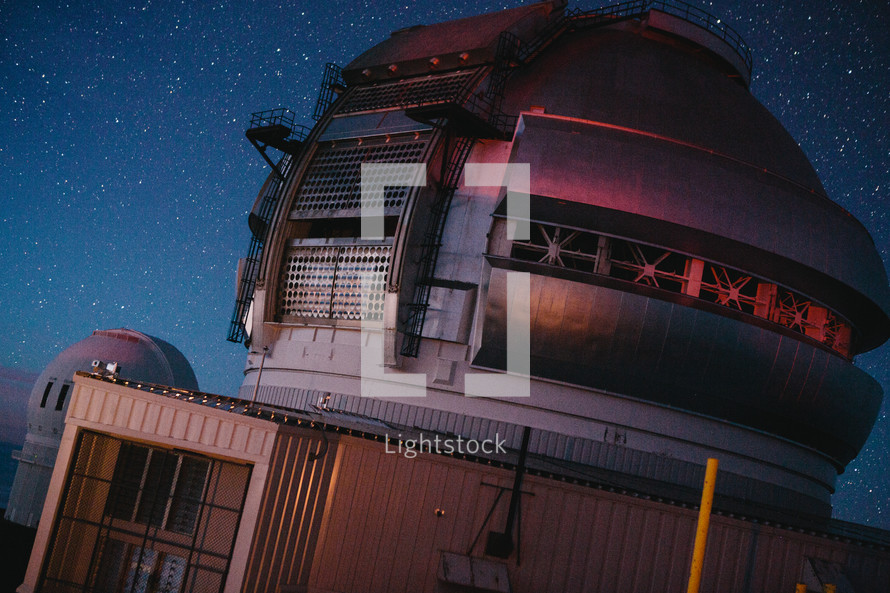 A planetarium under a starry sky.