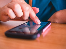 a person scrolling on a smartphone 