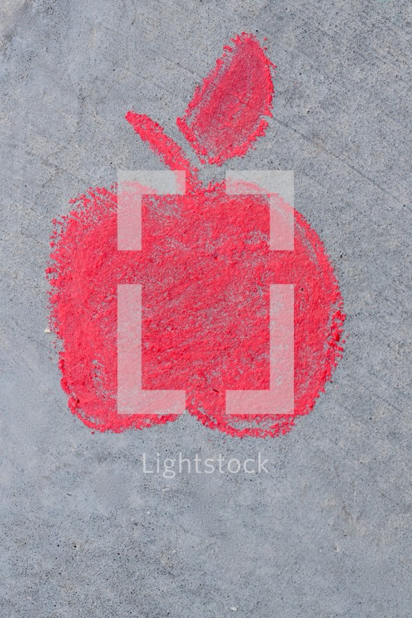 red apple in sidewalk chalk 