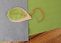 fabric leaf and needles and thread 