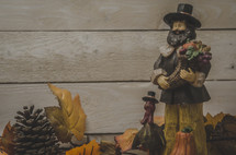 pilgrim and turkey figurines on a mantel 