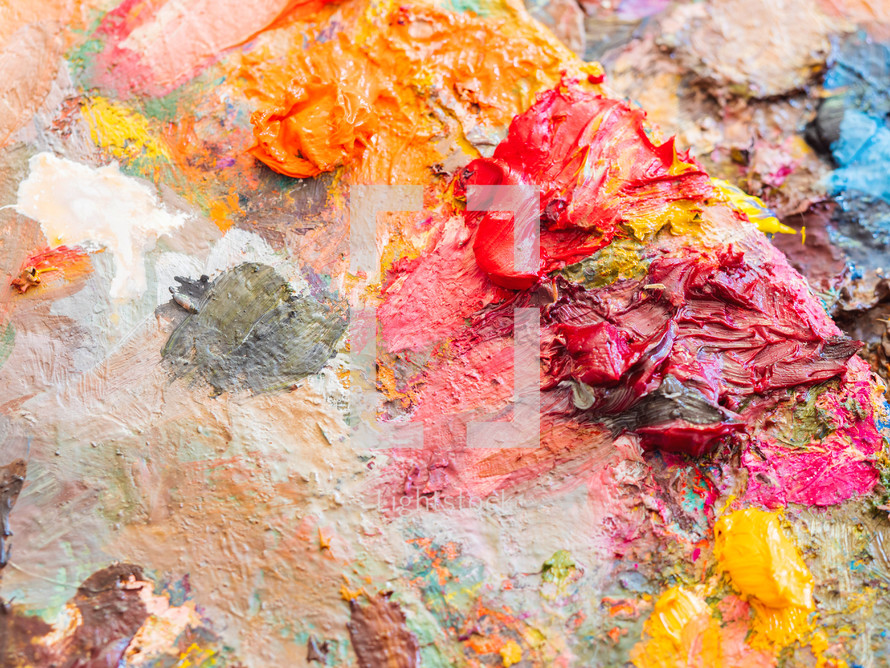  Artists multicolored oil paints on wooden palette or canvas. Close up abstract background. Art concept.