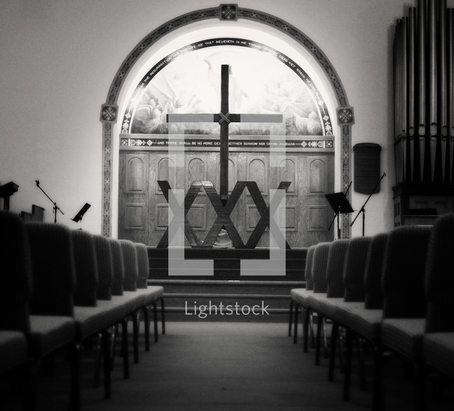 row of chairs in a church and altar 