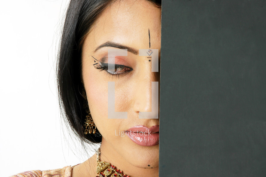 face of a woman with Bindi and makeup 