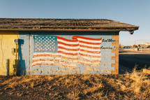 American flag painted on a building 