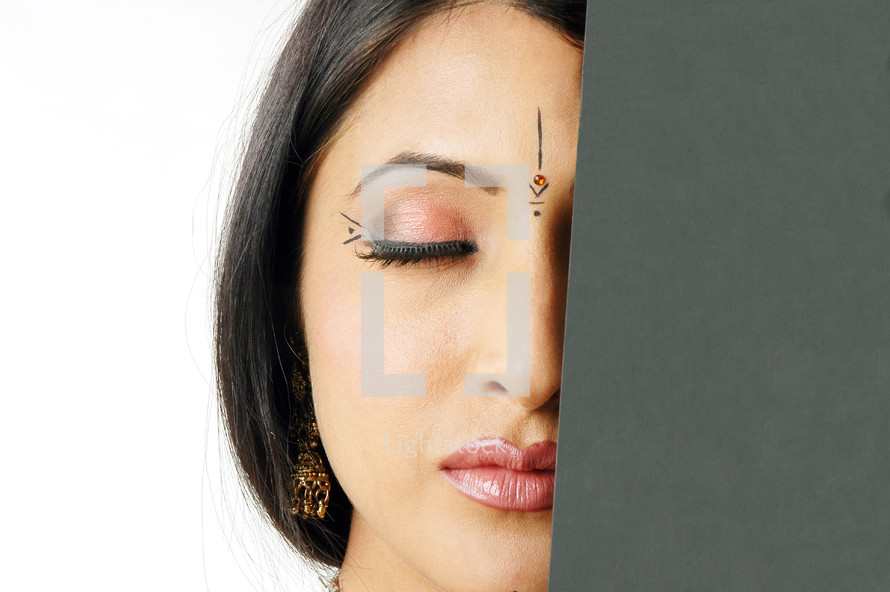 face of a woman with Bindi and closed eyes 