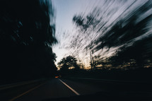 blur of trees and road 