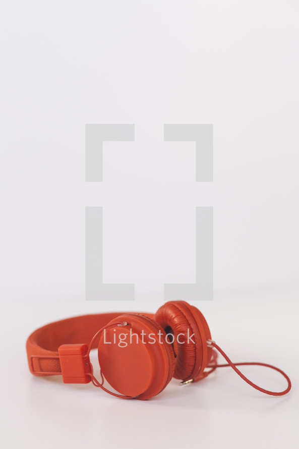 red headphones on a white background 