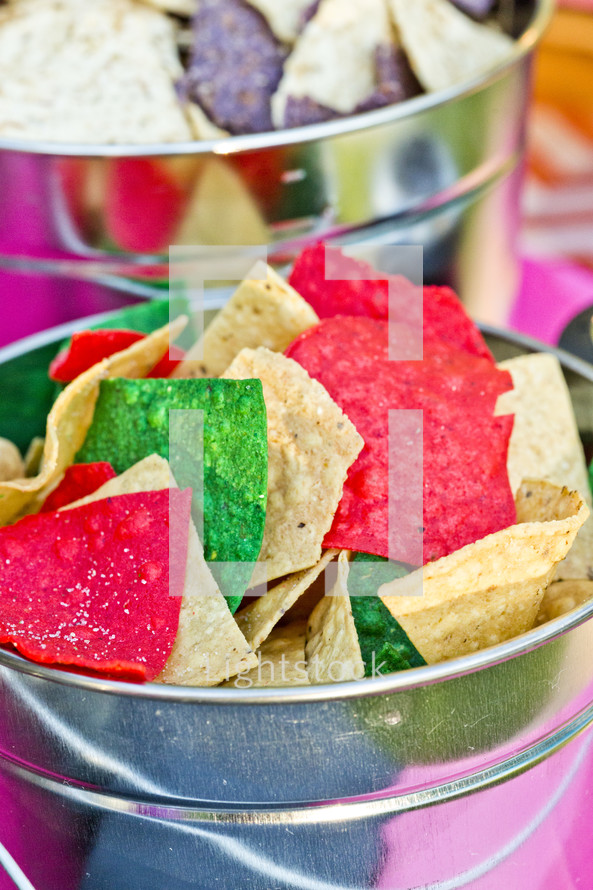 A bucket of colorful tortilla chips Mexican food bucket
