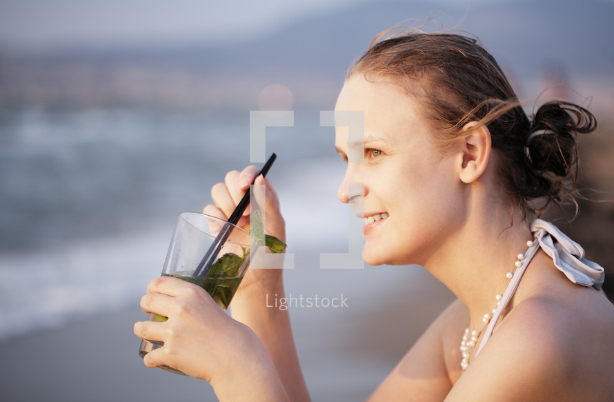 Woman enjoying an evening cocktail