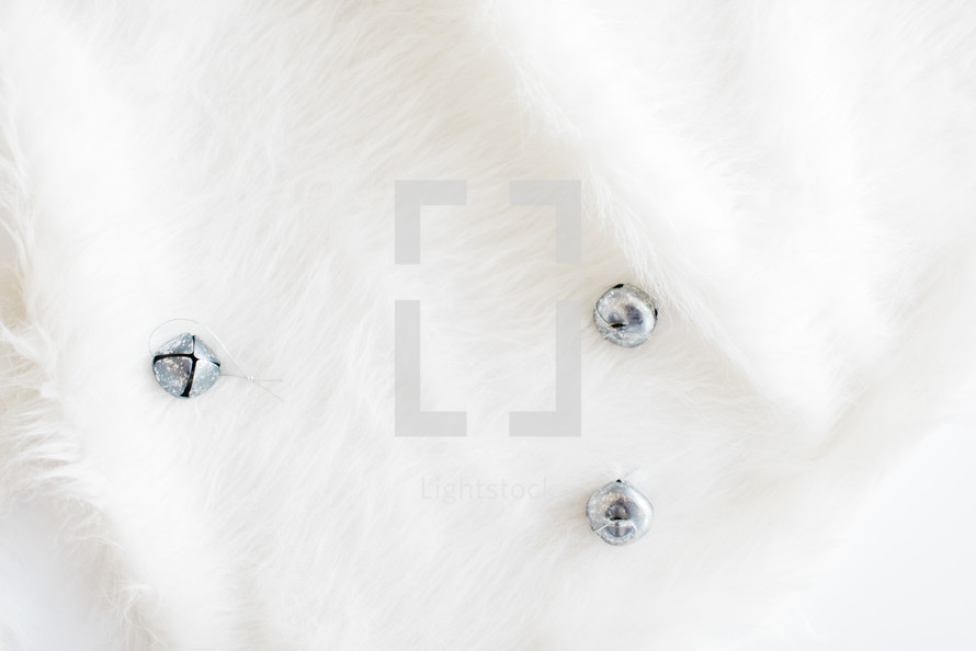 silver bells on white fur 