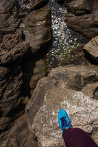 blue sneaker on a rock 