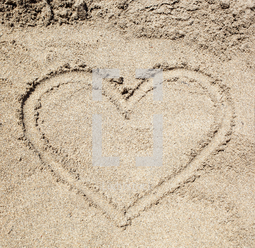 drawing a heart in the sand 
