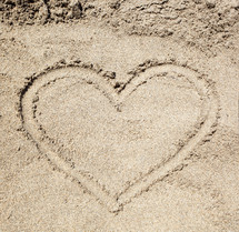 drawing a heart in the sand 