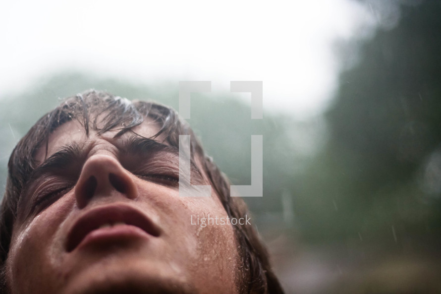 rain falling on a man's face
