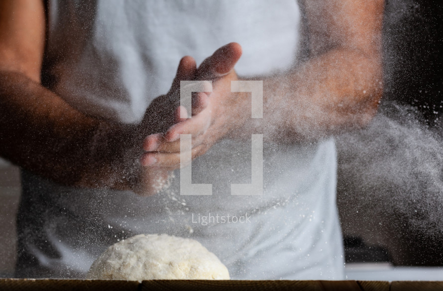 man kneading dough and making pizza 