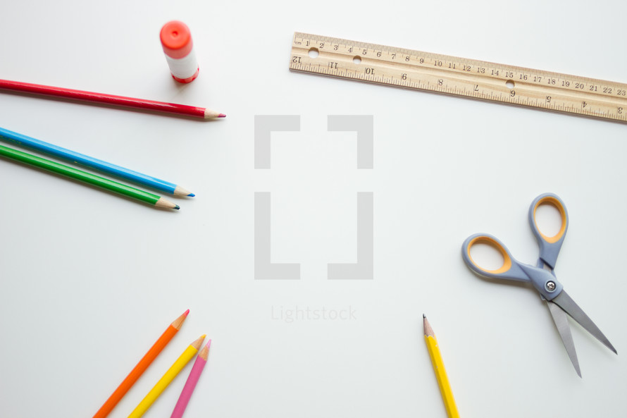colored pencils, scissors, ruller, glue stick, and pencil 
