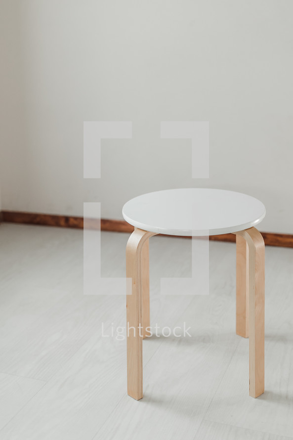empty stool in an empty room 