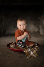infant with a vintage camera 